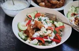 ?? GRETCHEN MCKAY — PITTSBURGH POST-GAZETTE ?? With some advance prep, this easy chopped chicken shawarma bowl makes a quick weeknight dinner.