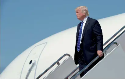  ?? AP ?? President Donald Trump walks down the steps of Air Force One at Andrews Air Force Base in Maryland on Wednesday. Trump went to the US Coast Guard Academy in New London, Connecticu­t, where he gave the commenceme­nt address. —