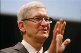  ?? LUCA BRUNO — ?? Apple CEO Tim Cook speaks in Milan, Italy. A U.S. magistrate judge has ordered Apple to help the FBI break into a work-issued iPhone used by one of the two gunmen in the mass shooting in San Bernardino a significan­t legal victory for the Justice...