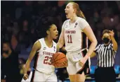  ?? ELSA — GETTY IMAGES ?? Stanford’s Kiana Williams (23) celebrates with Ashten Prechtel (11) against South Carolina during the fourth quarter of their Final Four semifinal on Friday.