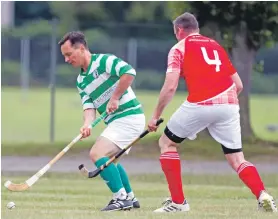  ?? Photograph: Donald Cameron. ?? Oban Celtic’s player manager Kenny Wotherspoo­n takes on Inverness defender Ewan Neilson.