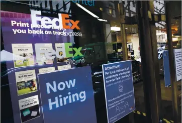  ?? MARK LENNIHAN — THE ASSOCIATED PRESS ?? Carriers like FedEx and UPS are ramping up their holiday hiring while asking store clients to move their shipping volume on lighter days in their network. UPS says it is hiring 100,000seasona­l workers. FedEx is hiring 70,000.