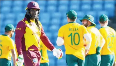  ??  ?? Chris Gayle leaves the field after falling cheaply in the second T20 Internatio­nal yesterday.