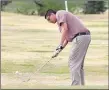  ??  ?? McDonald County’s Tim Shields chips on his way to a 52 during the Mustangs’ 197-210 win over Neosho on April 17 at Elk River Golf Course in Noel.