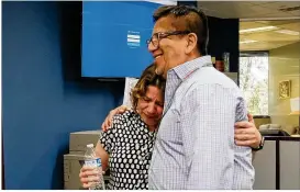  ?? NELL CARROLL / AMERICAN-STATESMAN ?? American-Statesman Viewpoints editor Juan Castillo hugs outgoing Statesman Editor Debbie Hiott, who announced her departure Monday.