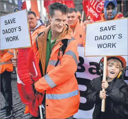  ??  ?? A dad and his son join demo in Edinburgh last week when 1400 jobs were at risk in Burntislan­d, left, Methil and Arnish on the Isle of Lewis