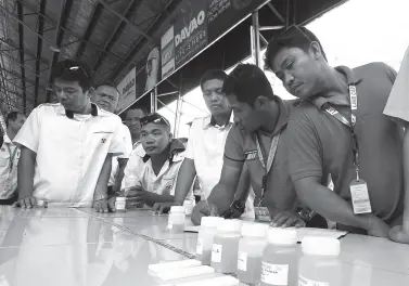  ??  ?? BUS DRIVERS and conductors wait for their urine result following a surprised drug test called “Undaspot” initiated by the Philippine Drug Enforcemen­t Agency inside the Davao City Overland Transport Terminal on Monday. BING GONZALES