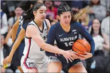  ?? JESSICA HILL/AP PHOTO ?? In this Feb. 27 file photo, UConn’s Ines Bettencour­t, left, pressures Xavier’s Fernanda Ovalle in the second half of a game in Storrs.