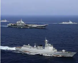  ?? (Reuters) ?? CHINESE VESSELS take part in a military drill in the western Pacific Ocean in April.