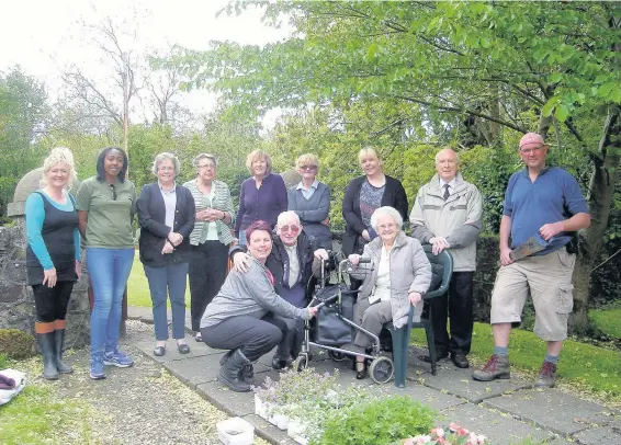  ??  ?? Working together
As part of Dementia Awareness Week, a day in the garden planting the raised beds was arranged at Cambuslang Parish Church’s Kirkhill building