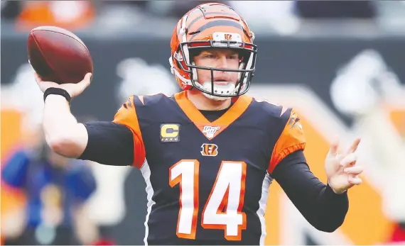  ?? BOBBY ELLIS/GETTY IMAGES FILES ?? Quarterbac­k Andy Dalton went 70-61-2 with the Cincinnati Bengals but the “Red Rifle” was let go by the team on Thursday coming off his worst season.