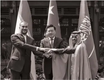  ?? AP ?? The foreign ministers of Iran, China and Saudi Arabia, Hossein Amirabdoll­ahian, Qin Gang and Prince Faisal bin Farhan, after the recent talks to restore the regional nations’ ties