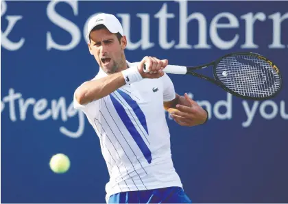  ?? MATTHEW STOCKMAN/GETTY IMAGES ?? Novak Djokovic has a perfect record this year, winning all 21 matches he has played.