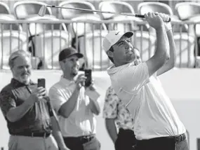  ?? Gregory Shamus / Getty Images ?? Masters champion and No. 1-ranked Scottie Scheffler watches his tee shot during Wednesday’s pro-am before the AT&T Byron Nelson tournament