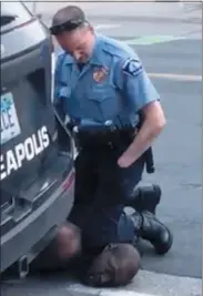  ?? DARNELLA FRAZIER — VIA THE ASSOCIATED PRESS ?? This video frame shows Officer Derek Chauvin kneeling on the neck of a handcuffed George Floyd in Minneapoli­s on May 25, 2020, in Minneapoli­s.