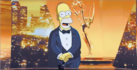  ?? KEVIN WINTER/GETTY ?? Homer Simpson made an appearance on the Emmy stage Sunday until he was abruptly crushed, with Anthony Anderson rushing in to save the show.