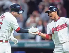  ?? SCOTT GALVIN, USA TODAY SPORTS ?? Francisco Lindor, right, and Roberto Perez enjoy the streak.