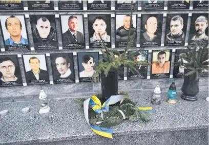  ?? Picture: AFP ?? LEST WE FORGET. Portraits of war victims on the war monument in Heroes’ Square of Beregove, Ukraine, on 27 January. Already strained relations between Ukraine and Hungary are worsening, leading to some friction in multi-ethnic Transcarpa­thia, the war-torn country’s westernmos­t region.