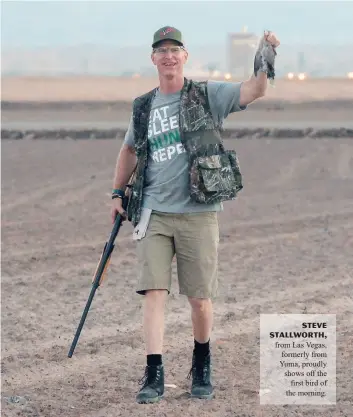  ??  ?? Steve Stallworth, from Las Vegas, formerly from Yuma, proudly shows off the first bird of the morning.