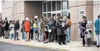  ?? MADDIE MCGARVEY/THE NEW YORK TIMES ?? Voters wait to cast early ballots on Monday in Columbus, Ohio. Tuesday’s scheduled primary in the state is set to be halted by the state’s health director.