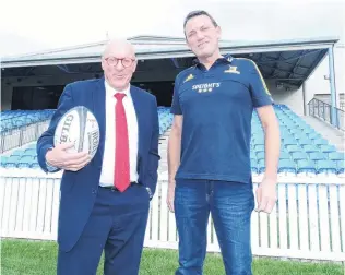  ?? PHOTO: GUY WILLIAMS ?? Game on . . . Queenstown Lakes Mayor Jim Boult (left) and Highlander­s chief executive Roger Clark at Sir John Davies Oval yesterday.