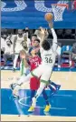  ?? CHRIS SZAGOLA / AP FILE ?? Philadelph­ia’s Seth Curry fouls Boston’s Marcus Smart as he shoots during the second half on Friday in Philadelph­ia.