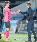  ??  ?? Daniel Mackay is congratula­ted by ICT caretaker-boss
Neil Mccann