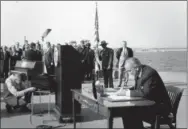 ?? THE ASSOCIATED PRESS ?? President Lyndon B. Johnson sits at his desk on Liberty Island in NewYork Harbor on Oct. 3, 1965, and signs a new immigratio­n bill. Fifty years later, there’s little that hasn’t been changed as a result of the Hart-Celler Act that Johnson signed. A...