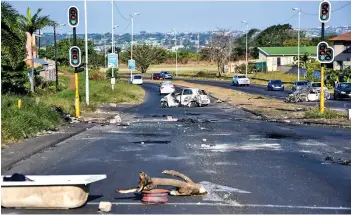  ?? /Gallo Images ?? Burnt out cars in Phoenix following violence that engulfed the community during the July 2021 unrest in Kwazulu-natal.