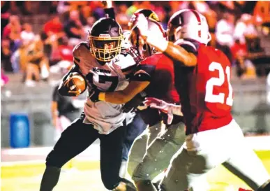  ?? FILE PHOTO BY CADE DEAKIN ?? McMinn County running back Jalen Hunt, with ball, will try to add to his program career rushing yardage record in his final season with the Cherokees of Region 2-6A.