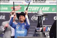  ?? Larry Papke / Associated Press ?? Kyle Larson celebrates after winning a NASCAR Cup Series auto race at Texas Motor Speedway on Sunday in Fort Worth, Texas.