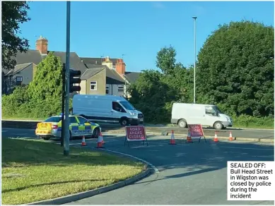 ??  ?? SEALED OFF: Bull Head Street in Wigston was closed by police during the incident