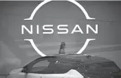  ?? EUGENE HOSHIKO/AP ?? Japanese automaker Nissan reported a net profit of $1.7 billion for the fiscal year through March, a reversal from the $3.5 billion loss recorded the previous fiscal year.