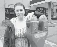  ?? JONATHAN CHARLTON/The StarPhoeni­x ?? Brittany Berge, a barista at Mystic Java, isn’t happy with the idea of having an even harder time finding parking downtown.