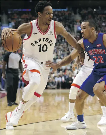  ?? DAVE ABEL / POSTMEDIA NEWS ?? DeMar DeRozan of the Raptors gets in on Avery Bradley of the Detroit Pistons in Toronto’s win at the Air Canada Centre on Wednesday night.