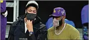  ?? MARCIO JOSE SANCHEZ / AP ?? Los Angeles Lakers injured players Anthony Davis, left, and LeBron James talk on the court during a game against the Utah Jazz Monday in Los Angeles.