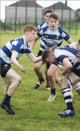  ??  ?? Hugh Kisby defends an attack from Sligo Grammar. Pics: Donal Hackett.