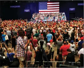  ?? STEVE MARCUS ?? Trump supporters cheer a performanc­e of the national anthem before the arrival of President Donald Trump at Thursday’s rally at the Las Vegas Convention Center.