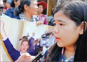  ?? PHA LINA ?? Tep Vanny’s daughter, Kong Panha, joins protesters yesterday outside the Supreme Court, where her mother’s 30-month sentence related to a 2013 protest was upheld.