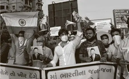  ?? Sam Panthaky / AFP via Getty Images ?? India protesters rally Tuesday against the killing of 20 Indian soldiers by Chinese troops in a brawl in the remote Galwan Valley, claimed by both countries, high up in the Himalayas. It was the worst such clash in more than 40 years.