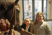  ?? JOSEPH PHELAN — JPHELAN@DIGITALFIR­STMEDIA.COM ?? Fourth-graders at Caroline Street Elementary School, Madison Finn and Peyton Mitchell enjoyed their off day at the Foal Patrol Kids event at The National Museum of Racing and Hall of Fame.