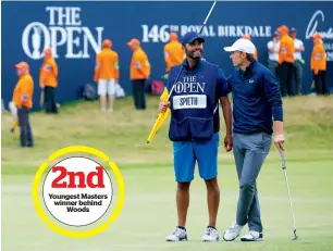  ?? AP file ?? Youngest Masters winner behind Woods Jordan Spieth stands with his caddie Michael Greller before putting on the 18th green at the British Open Golf Championsh­ip. —