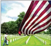  ?? (Arkansas Democrat-Gazette/John Sykes Jr.) ?? A man walks through Little Rock National Cemetery on Monday.