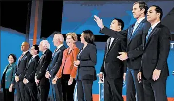  ?? FREDERIC J. BROWN/GETTY-AFP ?? Democratic presidenti­al hopefuls take the stage before debating Thursday night at Texas Southern University in Houston.