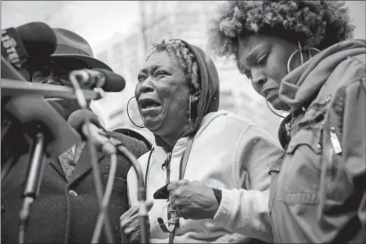  ?? JOHN MINCHILLO AP PHOTO ?? Angie Golson, grandmothe­r of Daunte Wright, cries as she speaks Tuesday during a news conference outside the Hennepin County Government Center in Minneapoli­s. Daunte Wright, 20, was shot and killed by police Sunday after a traffic stop in Brooklyn Center, Minn.