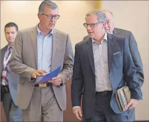  ?? CP PHOTO ?? Newfoundla­nd and Labrador Premier Paul Davis, left, walks with Saskatchew­an Premier Brad Wall at the summer meeting of Canada’s premiers in St. John’s Thursday.