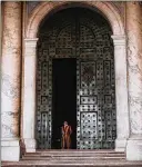  ?? IMAGES SPENCER PLATT/GETTY ?? A Pontifical Swiss Guard stands in St. Peter’s Basilica in Vatican City in September. The swift response to Catholic priests’ sexual abuse by U.S. civil officials contrasts sharply with the Vatican’s pace.