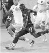  ?? STEPHEN M. DOWELL/SENTINEL ?? Orlando City winger Benji Michel scores during the Lions’ 4-1 win over the Chicago Fire on Sept. 19.