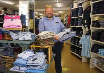  ??  ?? James Kehoe working in Mr H menswear on Quay street back open after Covid-19 restrictio­ns.