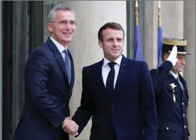  ?? REUTERS ?? NATO Secretary General Jens Stoltenber­g and French President Emmanuel Macron shake hands before a meeting at the Elysee Palace in Paris, France, on Thursday.